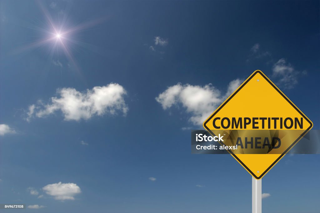 Competition ahead warning sign concept Competition Stock Photo