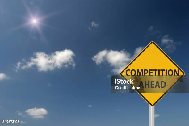 Competition Ahead Warning Sign Concept Stock Photo - Download Image Now - Competition, Sport, Business