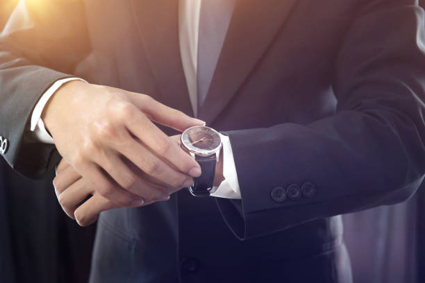 istock Closeup watch on hand businessman. 849673524