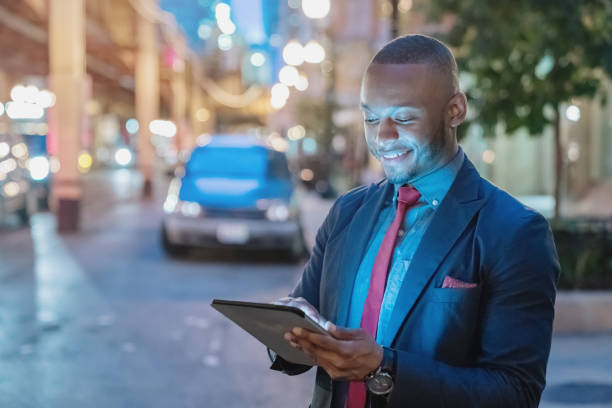 istock Businessman in the City looking into Digital Tablet Computer 849673760
