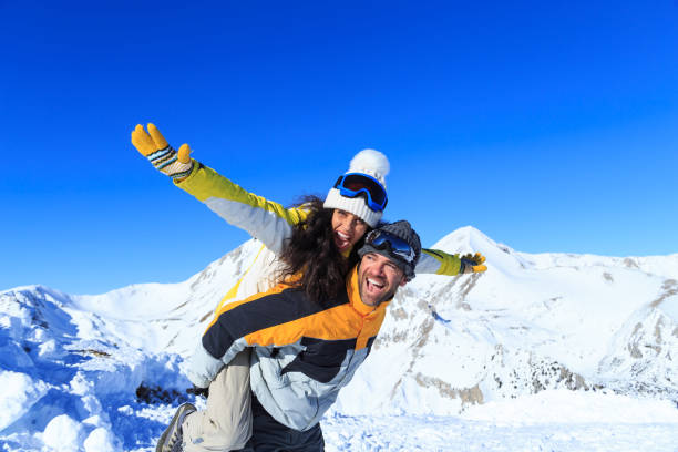 istock Young couple skiers having fun on top snow mountain 849676874