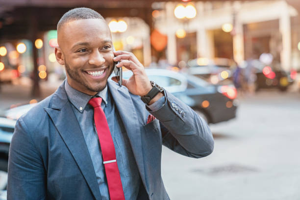istock Smiling Business Commuter talking on Mobile Phone 849677132