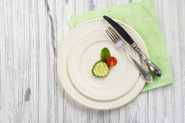 Small portion of food. Anorexia or unhealthy diet concept. Top view