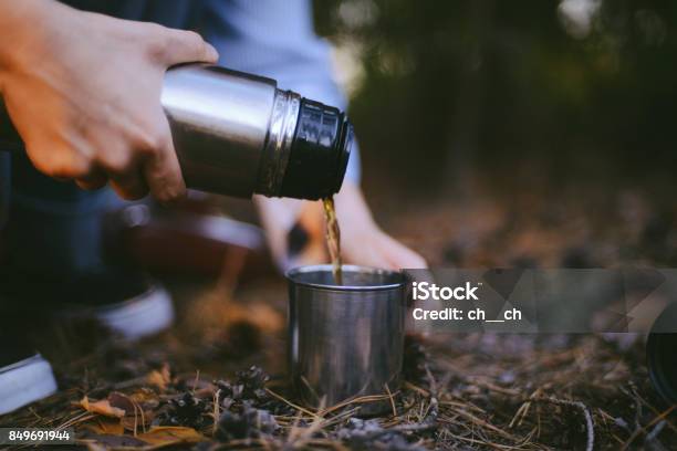 https://media.istockphoto.com/id/849691944/photo/traveler-girl-pouring-tea-from-thermos-cup-outdoors-young-woman-drinking-tea-at-cup-theme.jpg?s=612x612&w=is&k=20&c=vIhWIC7diKD2IkRoGhS95VorFn0ZuNolRkGjIzjQ_Zg=