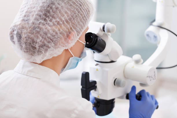 istock professional dentist examination patient with microscope at the office 849696234