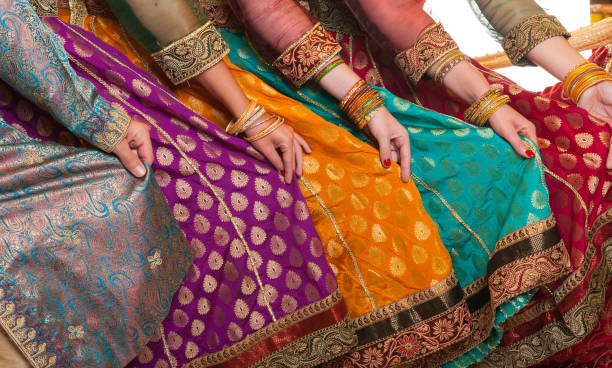 Bollywood dancers dress Bollywood dancers are holding their vivid costumes. Hands are in a row arab culture photos stock pictures, royalty-free photos & images