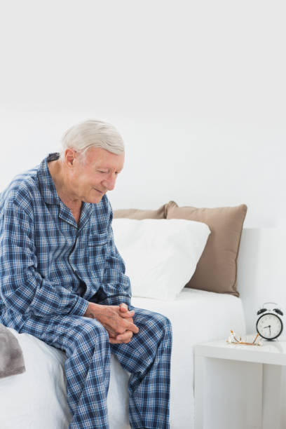 istock Calm elderly man sitting on the bed 849699568