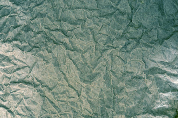 istock The Crumpled paper surface texture background , retro color tone 849700732