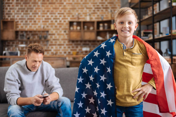istock Pleasant pre-teen boy posing with US flag 849704792