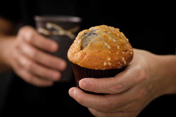 istock Hands holding a muffin look delicious. 849708984