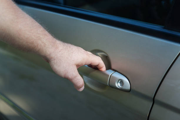 istock man's hand opens the car door 849711472