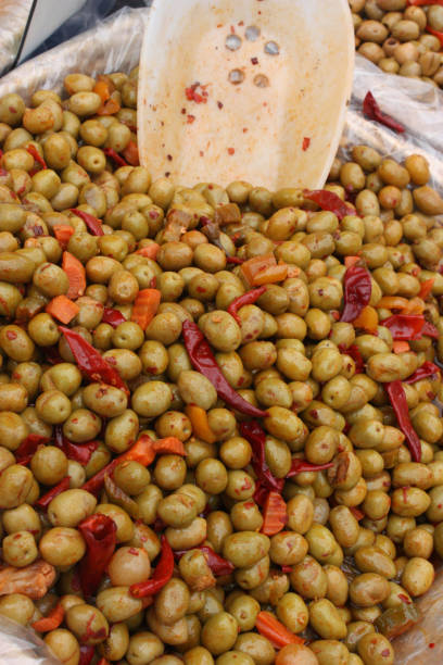 istock Green olives with red pepper 849711768