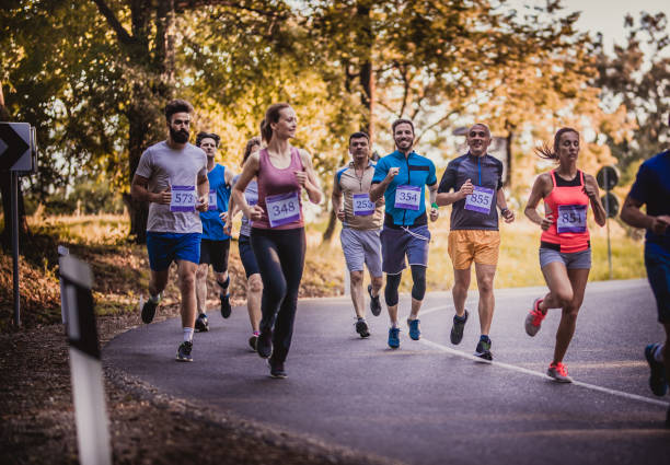 istock Large group of marathon runners on an asphalt road. 849712880