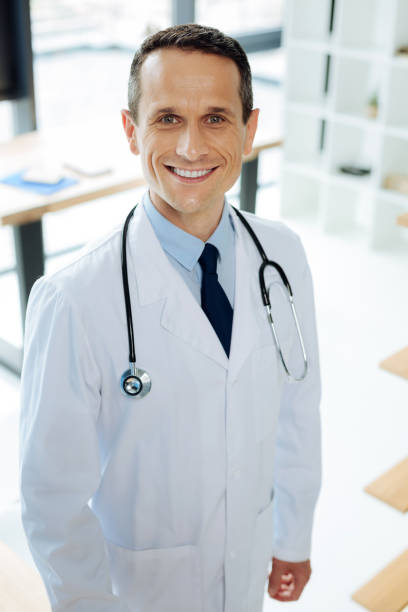 istock Delighted happy doctor wearing a stethoscope 849715240