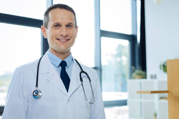 istock Positive delighted doctor smiling to you 849715366