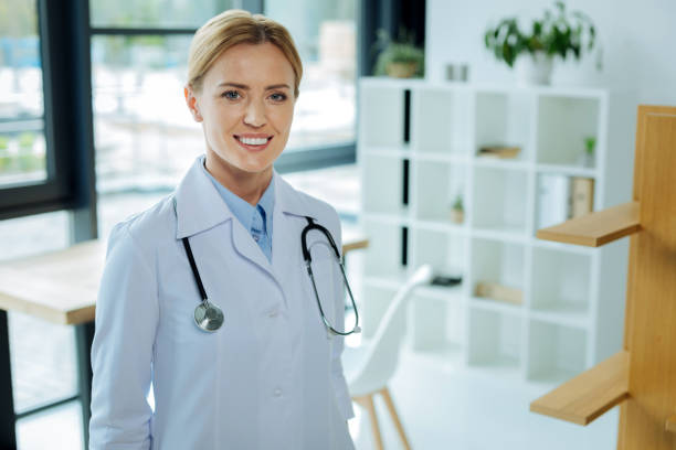 istock Attractive smart therapist standing in her office 849716758