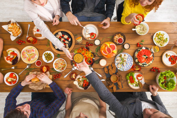 istock People eat healthy meals at served table dinner party 849719348