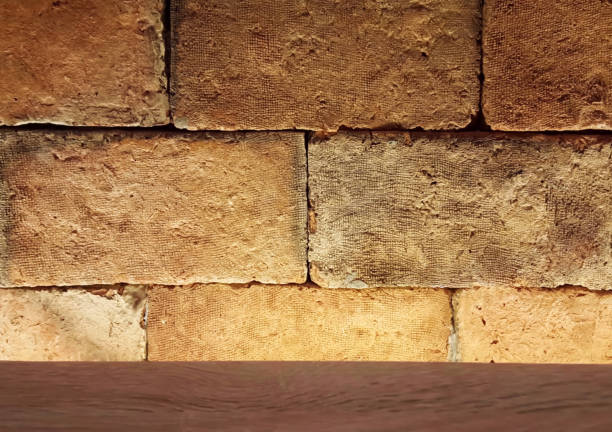 istock The large brick wall has light from the wash side and has a wooden frame below it 849720648