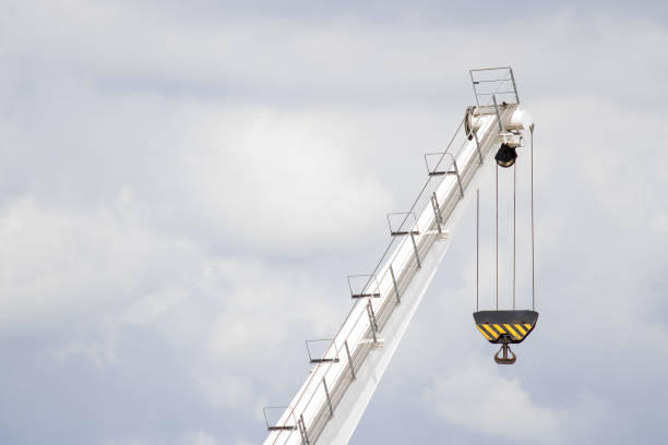 istock White lifting crane with black lifting hoop 849726954
