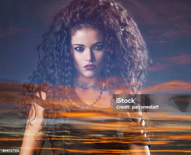 Double Exposure Of Rocker Woman And Colorful Sunset Stock Photo - Download Image Now