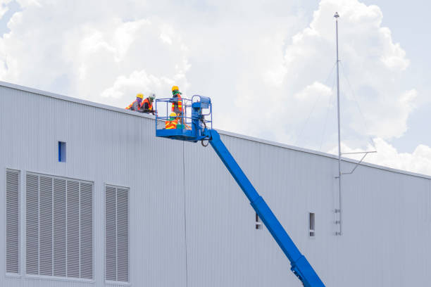 istock Workers in a baskets are installing sheet, building a factory. 849727646