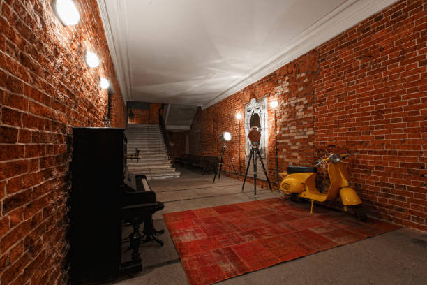 Modern industrial creative workspace. staircase with textured brick walls to the attic loft