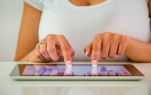 istock Close-Up Women Hands Writes a Letter On Tablet. 849735556