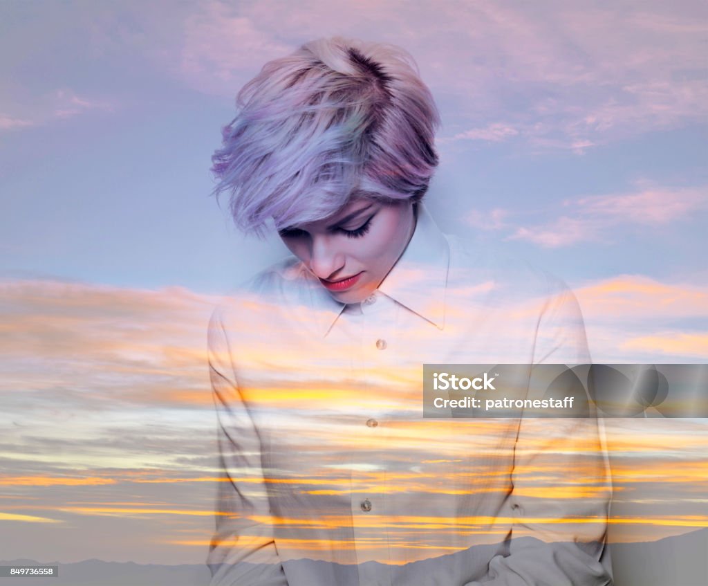 Double exposure of thoughtful girl and sunset Abstract Stock Photo