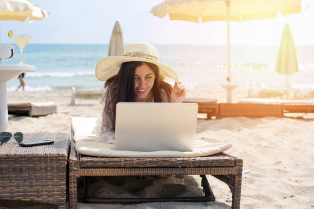 istock Women working in the beach with laptop 849739954