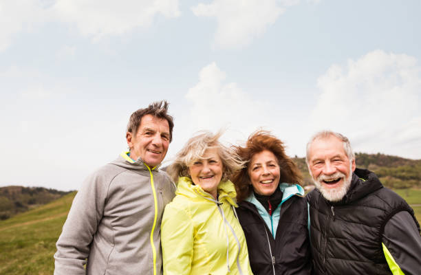 istock Group of senior runners outdoors, resting and hugging. 849740002