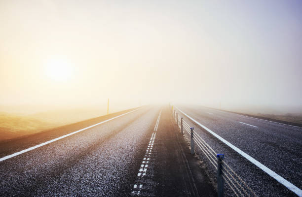 istock Asphalt road to the mountains Iceland 849745112