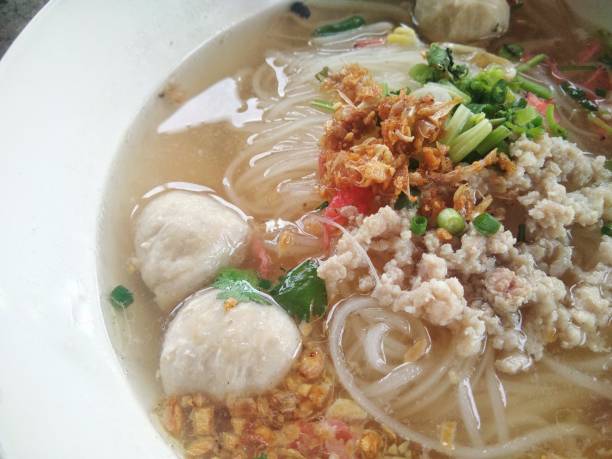 istock wide rice noodle soup with vegetables and pork ball 849748926