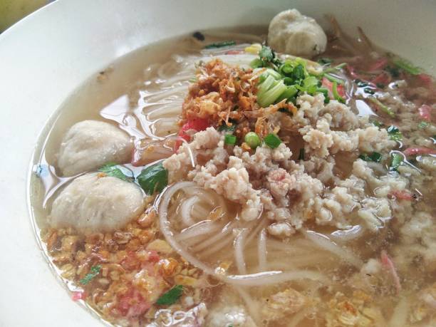 istock wide rice noodle soup with vegetables and pork ball 849749338
