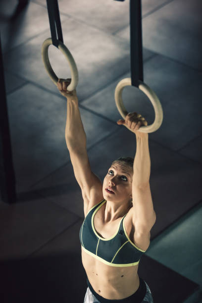 istock Young woman on gymnastic rings 849758012