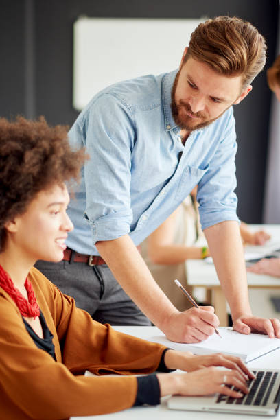 istock Businessman helping colleague 849763728