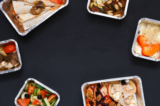 istock Healthy food take away in boxes, background on black 849764242
