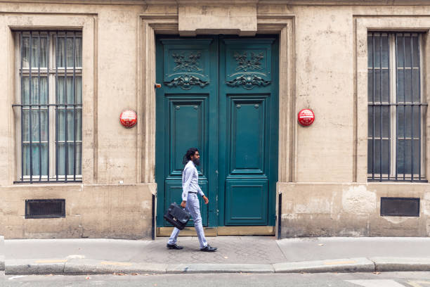 Pakistani man walking to work in the city, in Paris, France.