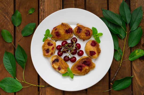istock Pancakes with cherries. Wooden background. Close-up. Top view 849764676