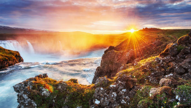 istock Godafoss waterfall at sunset. Fantastic landscape. Beautiful cumulus clouds. 849767444