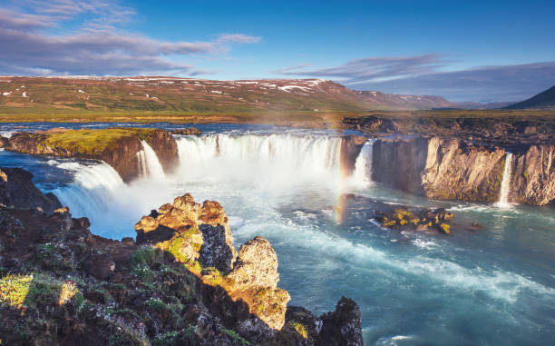 istock Godafoss waterfall at sunset. Fantastic landscape. Beautiful cumulus clouds. 849767814