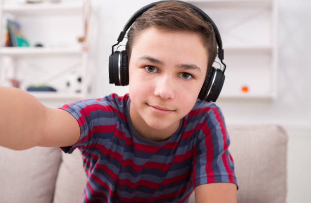 istock Boy in headphones taking selfie 849767990