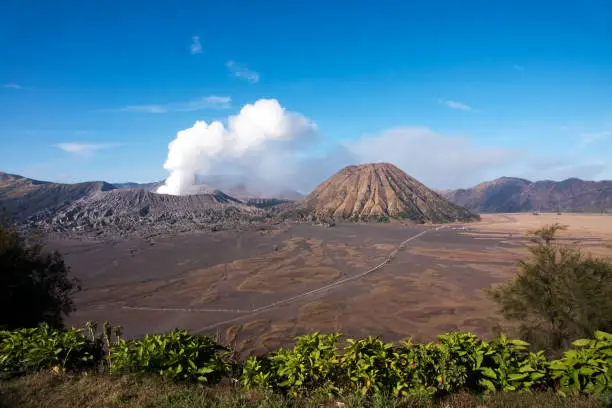 Mount Bromo, an active volcano with clear blue sky at the Tengger Semeru National Park in East Java, Indonesia.