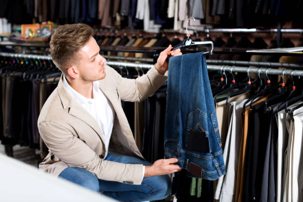 istock Man choosing on new trousers 849781934