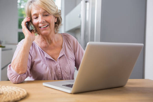 istock Happy woman using her laptop 849782166