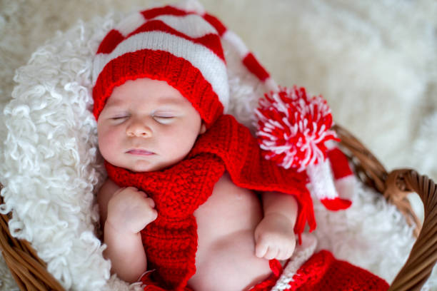 istock Little sleeping newborn baby boy, wearing Santa hat 849782680