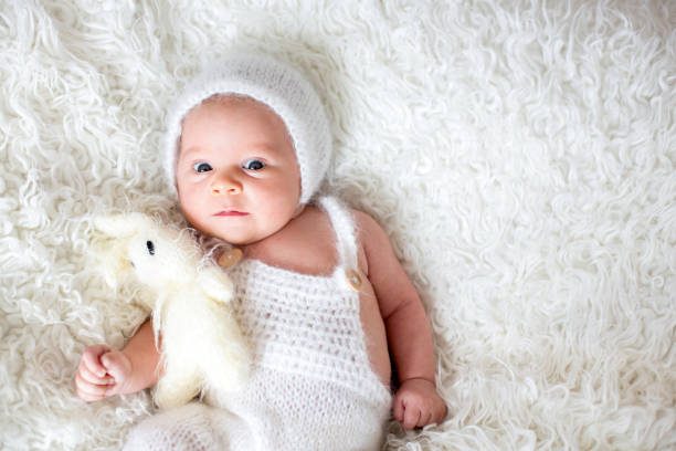 istock Beautiful newborn baby boy, looking curiously at camera 849782828