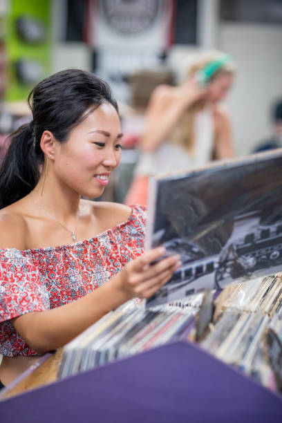 istock Young women in record store 849793794