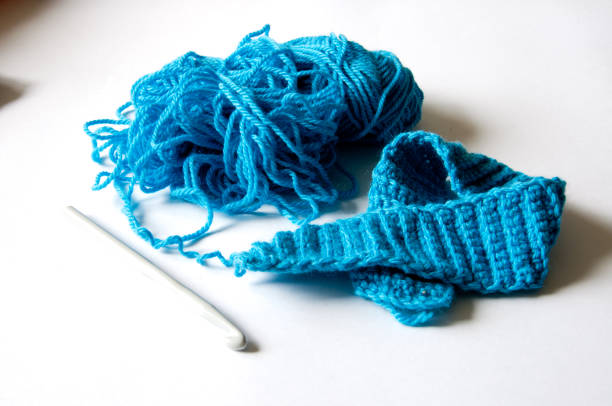 istock set for knitting. Crochet hook and thread for knitting 849796110