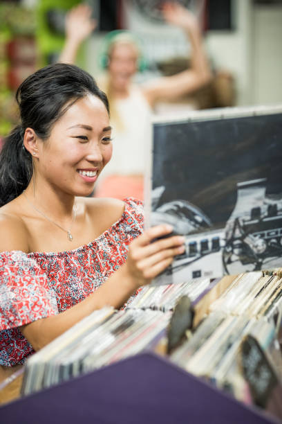 istock Young women in record store 849796294