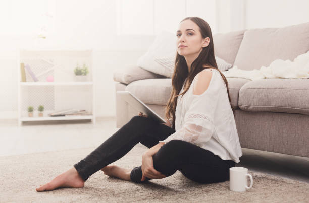 istock Girl with a tablet indoors 849805192
